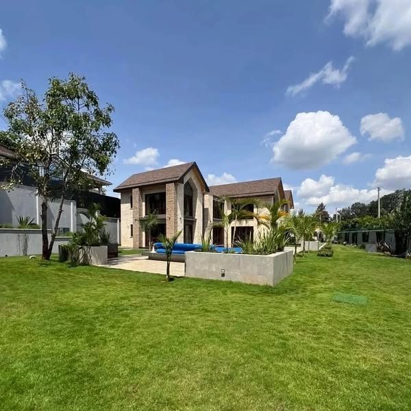 Runda — manicured lawn and modern two-storey houses