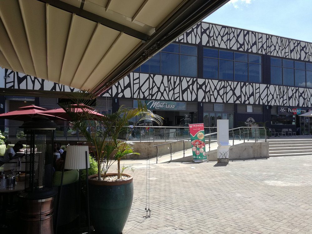Dining terraces under the town centre’s geometric facades
