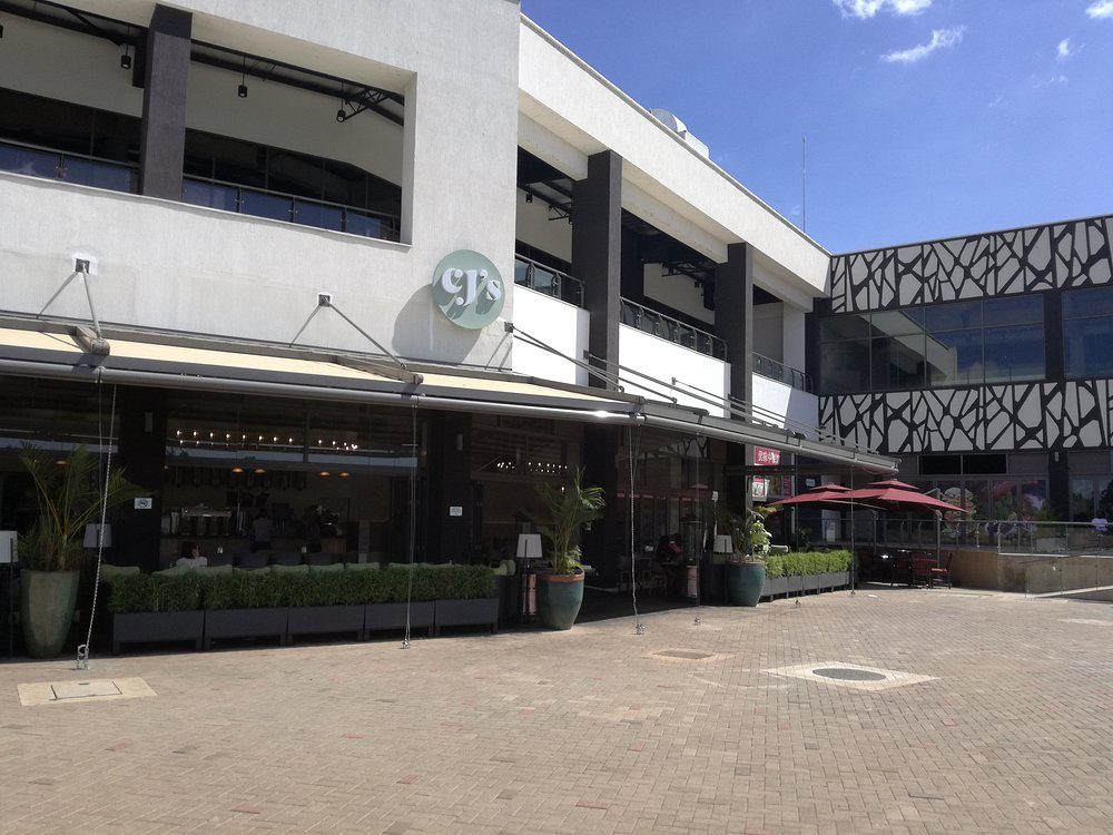 White terraces and awnings above the water feature